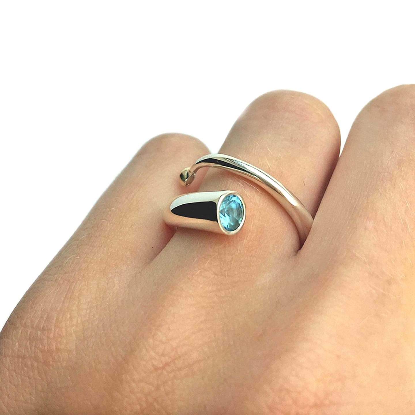 Silver and blue topaz spiral ring